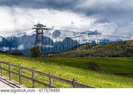 The Summer Sun's Rays Are Covered By A Dark Rain Cloud. A Promising View Of The Mountain Scenery Fro