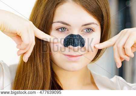 Woman Appying Clear-up Strips On Nose, Using Pore Cleansing Textile Mask For Blackheads. Girl Taking