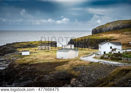 East Coast Homes And Buildings With Atlantic Cod Drying Racks On A Grassy High Rock Peninsula Near E