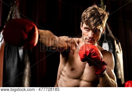 Boxing Fighter Shirtless Posing, Caucasian Boxer Punch His Fist In Front Of Camera In Aggressive Sta