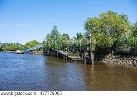 Old Wooden Pier At The Banks Of The River Scheldt, Appels, East Flemish Region, Belgium
