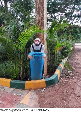 Beautiful Wooden Stem Shape And Monkey Shape Collecting Wastes On Park