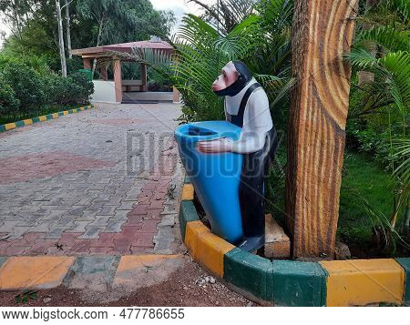 Beautiful Wooden Stem Shape And Monkey Shape Collecting Wastes On Park
