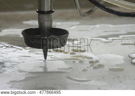 Close-up Scene Of Multi-axis Abrasive Waterjet Cutting Machine Cutting The Aluminum Plate. The High 
