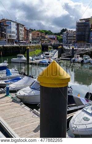Vacation On Green Coast Of Asturias, Views Of Llanes Touristic City With Old Harbour, North Of Spain