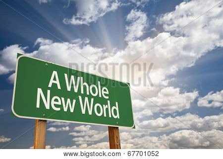 A Whole New World Green Road Sign with Dramatic Clouds and Sky.
