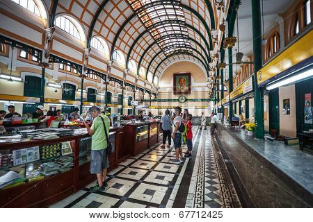 HO CHI MINH, VIETNAM - APRIL 28, 2014: Customers and tourists at the General Post Office. It was built by the French in 1880s and is now a popular tourist attraction in Ho Chi Minh city
