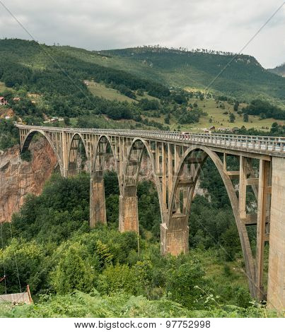 Old big bridge in Durdevica and fantastic view Tara river gorge - is the biggest one canyon in Europe in the national park Durmitor, Montenegro. Balkans. Beauty world.