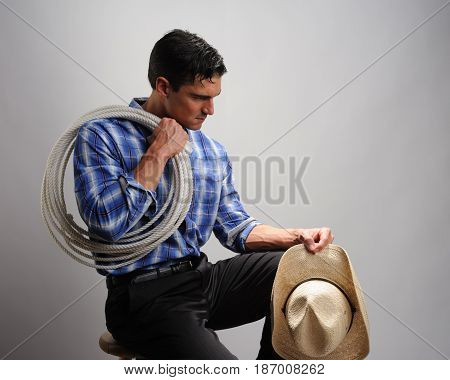The cute cowboy awaits his pretty lady of love.