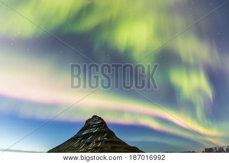 Northern Light Aurora Borealis At Kirkjufell Iceland With Fully Start In The Sky