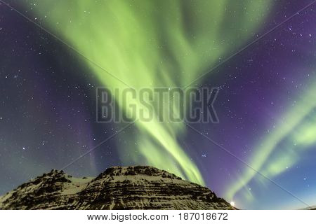 Northern Light Aurora Borealis At Kirkjufell Iceland With Fully Start In The Sky
