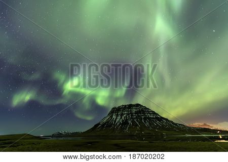 Northern Light Aurora Borealis At Kirkjufell Iceland With Fully Start In The Sky
