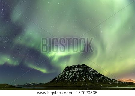 Northern Light Aurora Borealis At Kirkjufell Iceland With Fully Start In The Sky