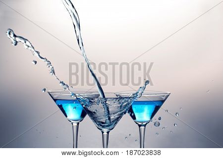 Cocktails martini drinks alcohol glasses spilling aperitif