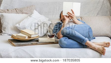 Girl Reading A Book In A Cozy Room