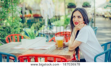 Beautiful Young Woman Drinking Beer And Enjoying Summer Day