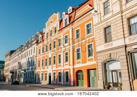Riga, Latvia. Facades Of Old Architectural Buildings On Jekaba Street Standing Close To Each Other In Old Town In Sunny Summer Day Under Blue Clear Sky.