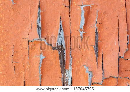 Aged weathered and peeling paint surface background.