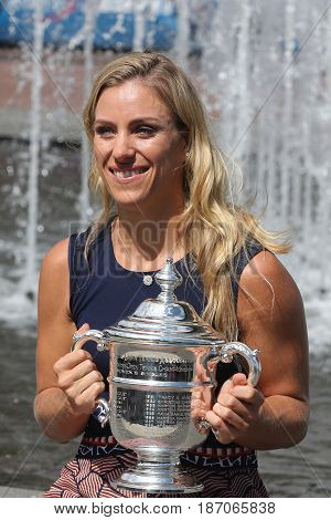 NEW YORK - SEPTEMBER 11, 2016: Two times Grand Slam champion Angelique Kerber of Germany posing with US Open trophy after her victory at US Open 2016 at Billie Jean King National Tennis Center