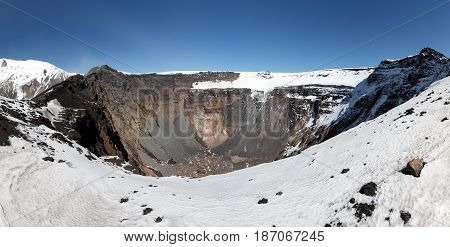 Panorama volcano landscape of Kamchatka Peninsula: large summit crater of active Tolbachik Volcano with steep sides and glaciers. Russian Far East Kamchatka Region Klyuchevskaya Group of Volcanoes.