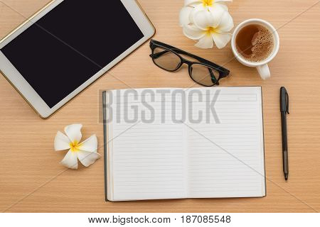 top view office with wooden table and laying on it with coffie