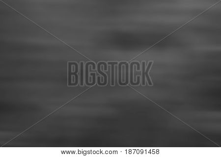 Dark grey black and white tones abstract gradient soft blur background