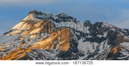 Winter sunset over the Grand Ferrand peak in Le Devoluy Massif in Hautes-Alpes France.