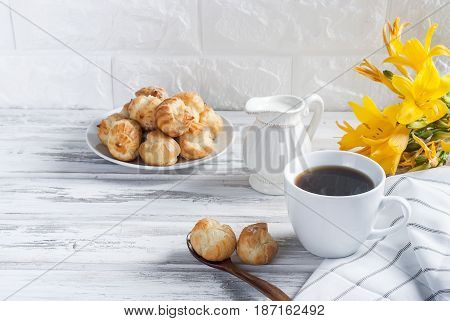 Coffee And Eclairs On A White Background