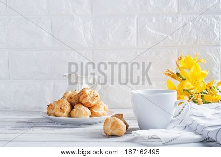 Coffee And Eclairs On A White Background