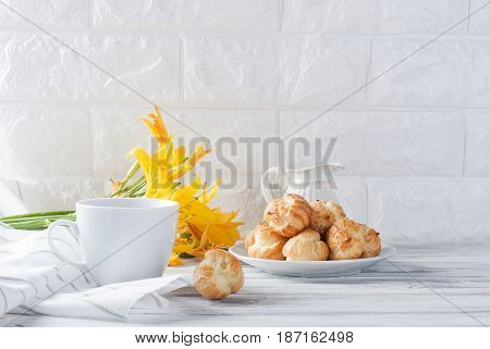 Coffee And Eclairs On A White Background