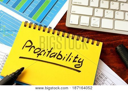 Notepad with word profitability on a table.
