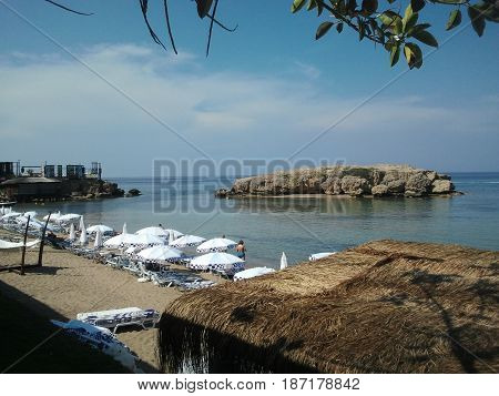 Beautiful rocky sea with magnificent beach on hot sunny day