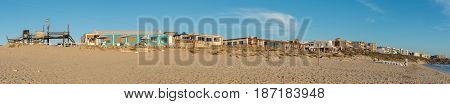 LANGEBAAN SOUTH AFRICA - APRIL 1 2017: Panorama of a beach at sunset in Mykonos in Langebaan a town on the Atlantic Coast of the Western Cape Province