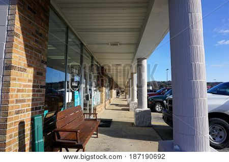 BAY VIEW, MICHIGAN / UNITED STATES - NOVEMBER 26, 2016: The covered walkway of a strip mall in Bay View, Michigan.
