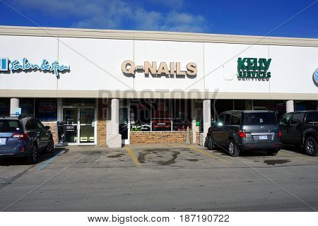 BAY VIEW, MICHIGAN / UNITED STATES - NOVEMBER 26, 2016: One may have one's nails trimmed at Q-Nails, in a Bay View strip mall.