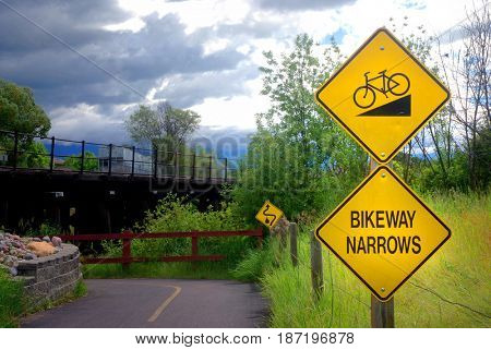 Bikeway narrows sign on bike path in Kalispell, Montana