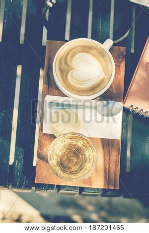 Cup of coffee on wooden tray. business concept.