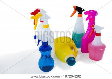 Close up of spry bottles against white background
