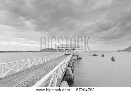 Black and White Wooden walking way over seacoast skyline nautral abstract background