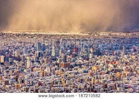 Sapporo, Japan downtown skyline with approaching snow storm.