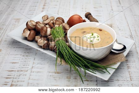 Creamy Mushroom Soup on wooden white background