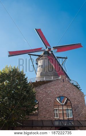 Windmill with red wings in Sluis Holland