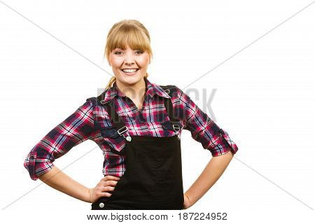 Gardening fahion concept. Smiling attractive woman in pink check shirt and dungarees hands on hips. Isolated background