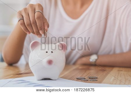 young beautiful woman saving money, selective focus, vintage