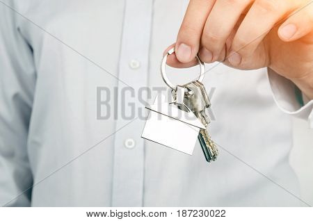 Estate Agent Holding Keys To New House