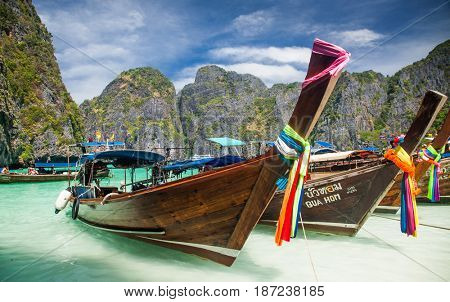 KO PHI PHI LEH, THAILAND, February 1, 2014: Traditional long tail boats on the beach of Maya Bay, Andaman Sea, famous tourist destination in the Ko Phi Phi achipelago