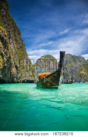 KO PHI PHI LEH, THAILAND, February 1, 2014: Traditional long tail boats on the beach of Maya Bay, Andaman Sea, famous tourist destination in the Ko Phi Phi achipelago