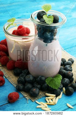Beautiful Appetizer Pink Raspberries Fruit Smoothie Or Milk Shake In Glass Jar With Berries Backgrou