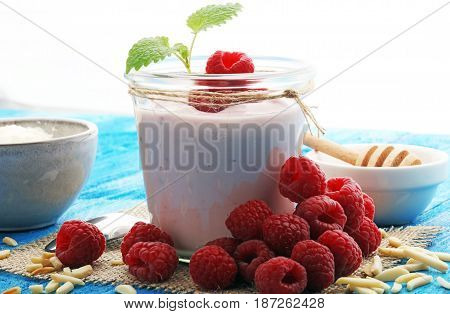 Beautiful Appetizer Pink Raspberries Fruit Smoothie Or Milk Shake In Glass Jar With Berries Backgrou