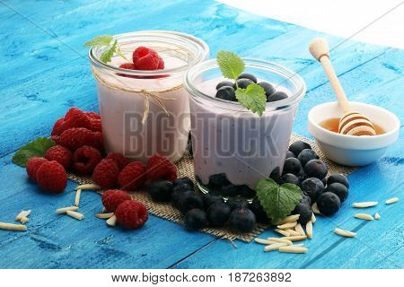 Beautiful Appetizer Pink Raspberries Fruit Smoothie Or Milk Shake In Glass Jar With Berries Backgrou
